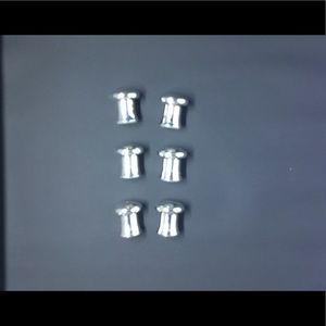 Small individual mini salt and pepper shakers.